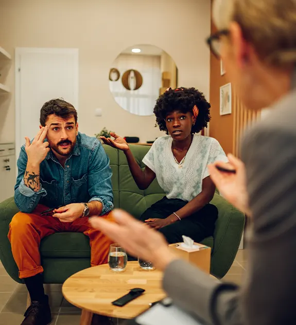 A diverse couple during a therapy session in a psychologist’s office