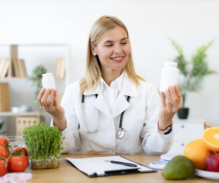 Lady Demonstrating Pills Bottles