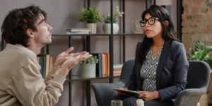 Man Telling About His Feelings In Therapy Session