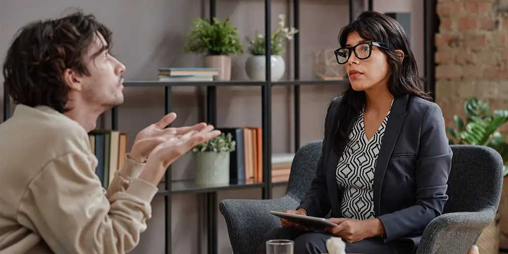 Man Telling About His Feelings In Therapy Session